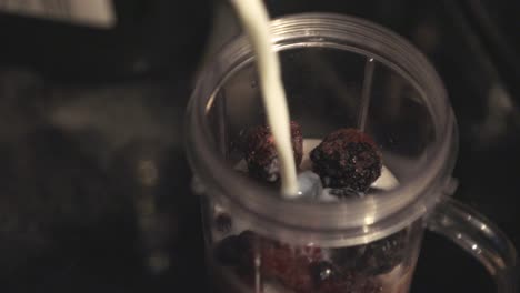 Adding-The-Milk-In-The-Blender-Jar-With-Dried-Fruits
