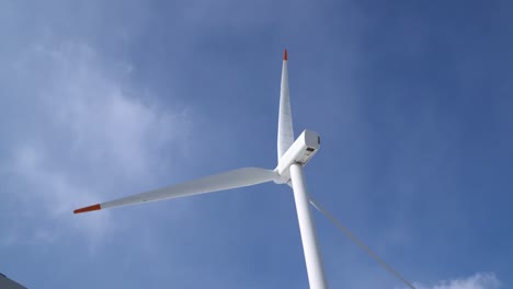 closeup-of-single-wind-power-turbine-on-blue-sky-background-in-Pyeongchang,-South-Korea
