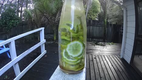 honey-flowing-in-the-bottle-with-lime.mp4