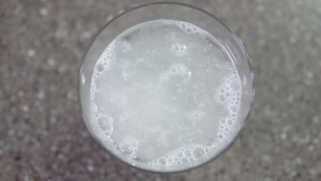 A-vitamin-C-tablet-dissolves-in-a-pure-water-glass