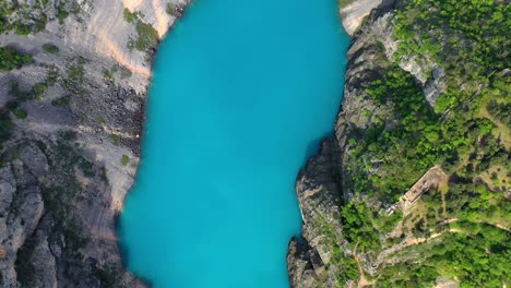 Birds-eye-view-of-a-beautiful-turquoise-water-lake
