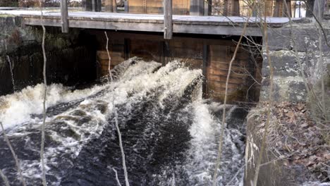 Water-gate-belonging-to-an-old-abandon-ironworks-with-cascading-water