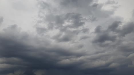 Mid-afternoon-thunderstorm-rain-clouds-forming-and-blending-across-the-african-horizon-time-lapse,-noise-free-4k-footage