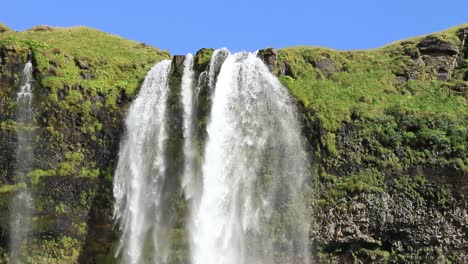Icelandic-waterfall,-famous-tourist-attraction,-Seljalandsfoss-in-south-Iceland