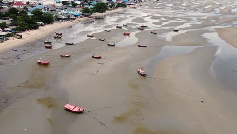 AERIAL,-Low-Tide-At-Bang-Sean-Beach,-Boats-Left-High-And-Dry