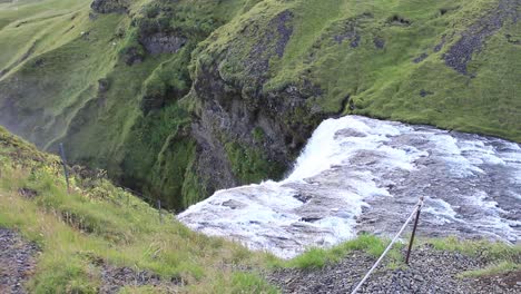 Magnificent-Skogafoss,-waterfall-in-south-Iceland,-where-it-burst-out-from-the-top-of-the-mountain