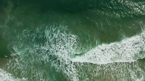 Aerial-views-of-tropical-waves-rolling-into-the-shore