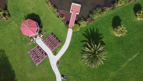 drone-down-from-sky-to-the-lawn-and-wedding-pavilion-pinky