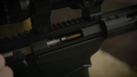 Shooter-reloading-bolt-action-rifle,-close-up-on-cartridge-ejected
