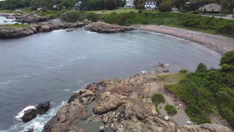 Aerial-view-of-a-beach-full-of-rock-and-stones,-landscape-drone-shot-in-Nahant