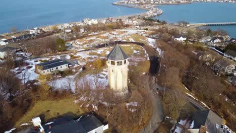 Aerial-view-of-tower-in-Fort-Revere-park-in-Massachusetts-with-Allerton-city-in-the-background