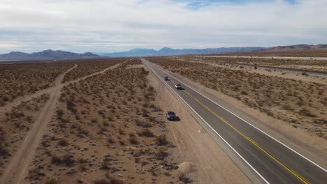 Road-on-a-Desert-landscape,-aerial-view,-dry-climate-in-Southwest-USA