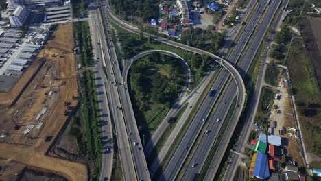 Vehicles-Passing-Through-Busy-Highway-In-Bangkok-Thailand---aerial-shot