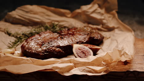 Seared-caramalized-filet-steak-with-rosemary-and-figs-on-paper,-food-photoshoot