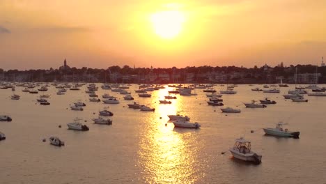 Big-yellow-sun-sunset-at-Marblehead-harbor-full-of-yachts,-Essex-County
