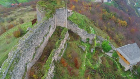 Aerial-shot-near-a-high-stone-wall-of-an-old-Castle-called-Stari-Grad-near-Pocitelj-town-in-Bosna-and-Herzegovina