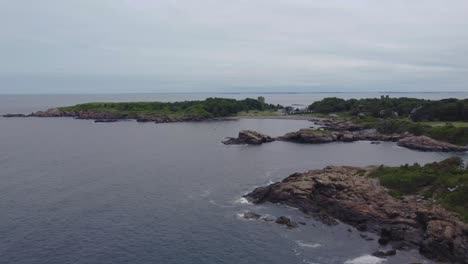 Panoramic-aerial-view-of-Nahant-rocky-shore-in-US,-marine-and-coastal-background
