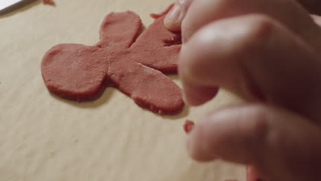 Making-a-gingerbread-men-with-hands,-handmade-detail-cookies-pastry-bakery