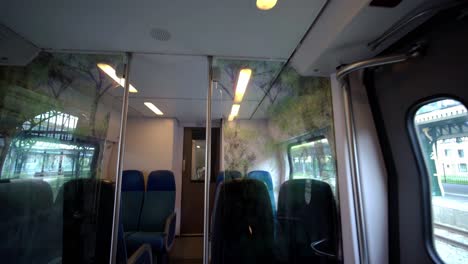 The-empty-public-train-of-Eindhoven,-Netherlands-during-the-Corona-Virus-infection-spread---reverse-wide