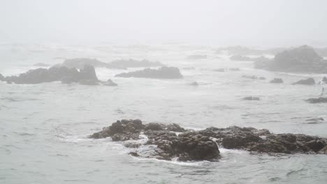 Mystical-Scenery-of-Rocky-Coastline-on-Grey-and-Misty-Day,-Slow-Motion