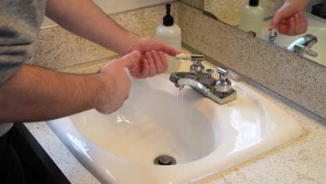 Correctly-washing-my-hands,-nice-angle-showing-the-surfaces-and-how-to-prevent-the-spread-of-COVID-19
