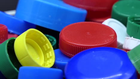 Closeup-of-Coloured-Plastic-Recycling-Plugs-that-rotate-slowly