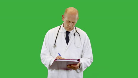 Front-view-of-a-doctor-wearing-a-scientist-white-lab-coat-is-listening-and-taking-notes-on-a-clip-board