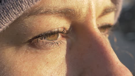 Macro-Close-Up-of-a-Woman-Opening-Her-Eyes-in-Slow-Motion-with-Golden-Sunset-Lighting