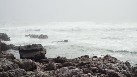 Rocky-Coastline-with-Big-White-Waves-Hitting-the-Shore-during-Day