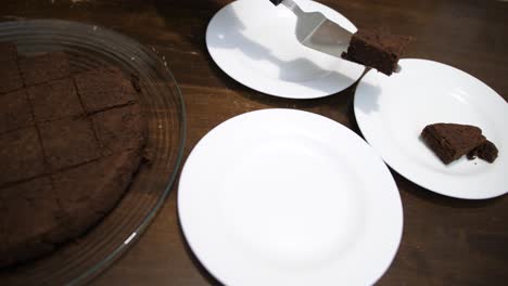 A-piece-of-Keto-Chocolate-Brownie-cake-being-served-on-a-white-plate