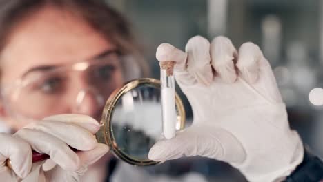 closeup-portrait-scientist-doctor-woman-looking-at-test-tube-magnifier