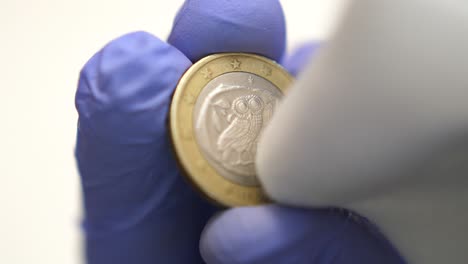 Isolated-close-up-of-the-backside-of-one-euro-coin-cleaned,-laundering