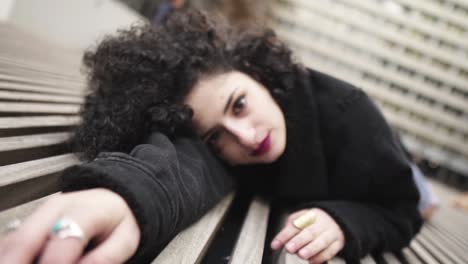 Gorgeous-mixed-raced-italian-looking-woman-resting-on-the-ground-with-lines-looking-in-the-camera-creative-movement