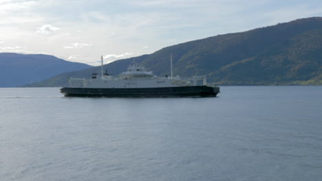 A-Ferry-Travels-through-a-Fjord-on-a-Sunny-Summer-Day-in-Norway,-Slow-Motion
