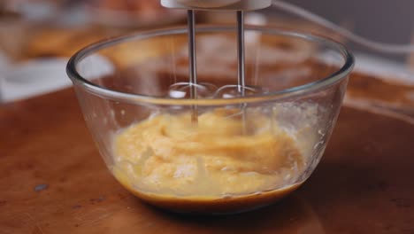 Mixing-eggs-and-sugar-in-a-bowl-with-hand-mixer