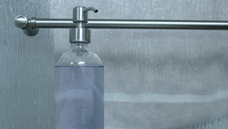 Bottle-of-hand-soap-hand-sanitizer-sitting-on-the-bathroom-sink