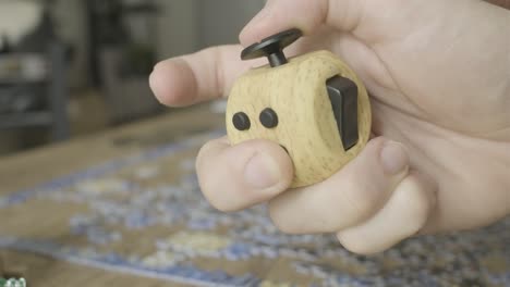 Hands-playing-around-With-a-Fidget-cube-toy