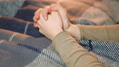 Praying-with-joined-hands-with-extreme-hope,-closeup