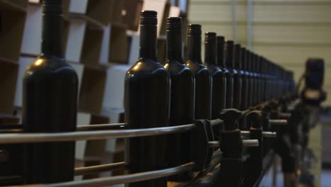 Winery:-Bottling-and-sealing-conveyor-line-at-factory-warehouse