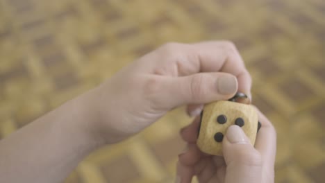 Woman's-Hands-playing-With-a-Fidget-cube-toy