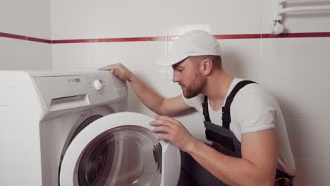 a-professional-plumber-shows-that-a-new-washing-machine-is-needed