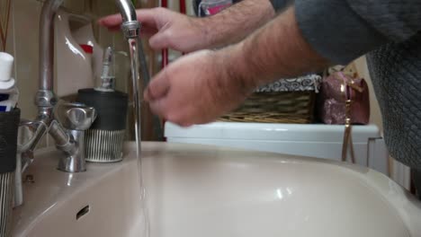 Washing-hands-in-a-sink