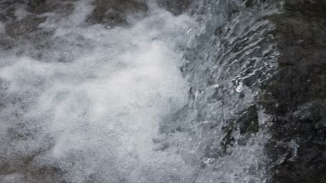 Close-up-waterfall,-water-falling-and-bubbling-slow-motion