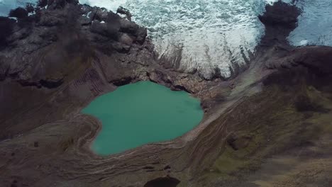 Aerial,-tracking,-drone-shot-tilting-towards-a-lake-underneath-the-Ausangate-Glacier,-in-Cusco-region,-Andes,-Peru
