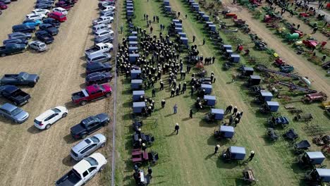 Aerial-View-of-an-Amish-Mud-Sale-Auctioning-Buggies,-Farm-Equipment-to-Quilts-on-a-Winter-Day