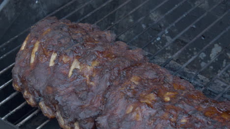 Spareribs-being-grilled-on-gas-barbecue