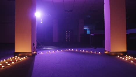 moving-towards-door-in-office-environment-with-candles-on-the-floor-for-prepared-ritual-mysterious-vibe