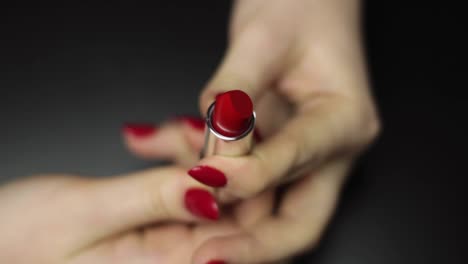 Seductive-red-lipstick-rolling-out-slowly-closeup