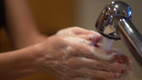 Female-Washing-Hands-With-Soap-and-Water-Close-Up