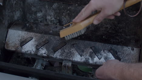 filthy-Barbecue-being-scrubbed-clean-with-metal-brush-in-slow-motion